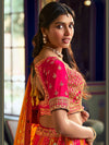Pink and mustard Banarasi silk bridal lehenga with zari and crystal work for a luxury wedding in New York