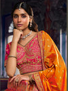 Pink and mustard bridal lehenga blouse with woven dupatta for an elegant Indian wedding in London
